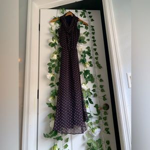 This is a dark navy blue dress with peach polka dots. It’s a small.